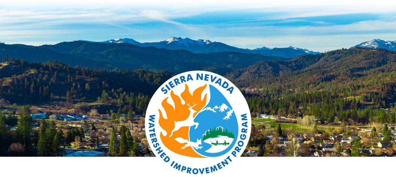 Sierra Nevada Watershed Improvement Program logo with town and mountainscape in the background
