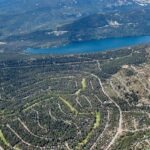 Aerial image facing north that overlooks Donner Lake and shows communities south of the lake.